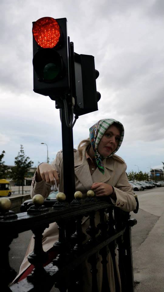 lowerpot women next  to lamppost
